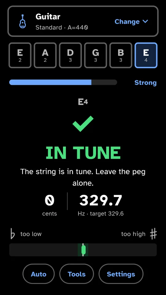 The tuner screen: guitar in standard tuning, high E string, “IN TUNE”, 0 cents.